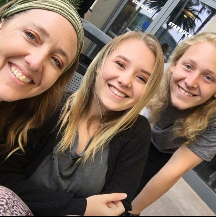 The Agen family smiles for a photo