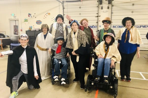 Students of L.I.F.E. Adult Day Academy pose in costume for A Christmas Carol