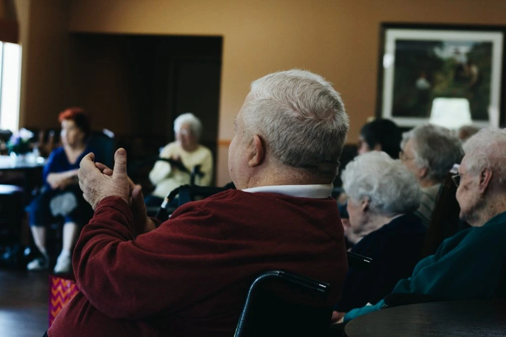 Resident claps at a performance