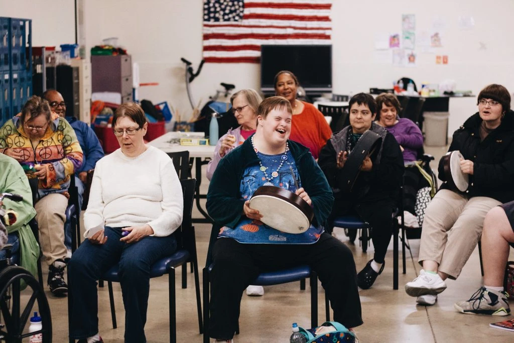 Woman plays drum while listening to music